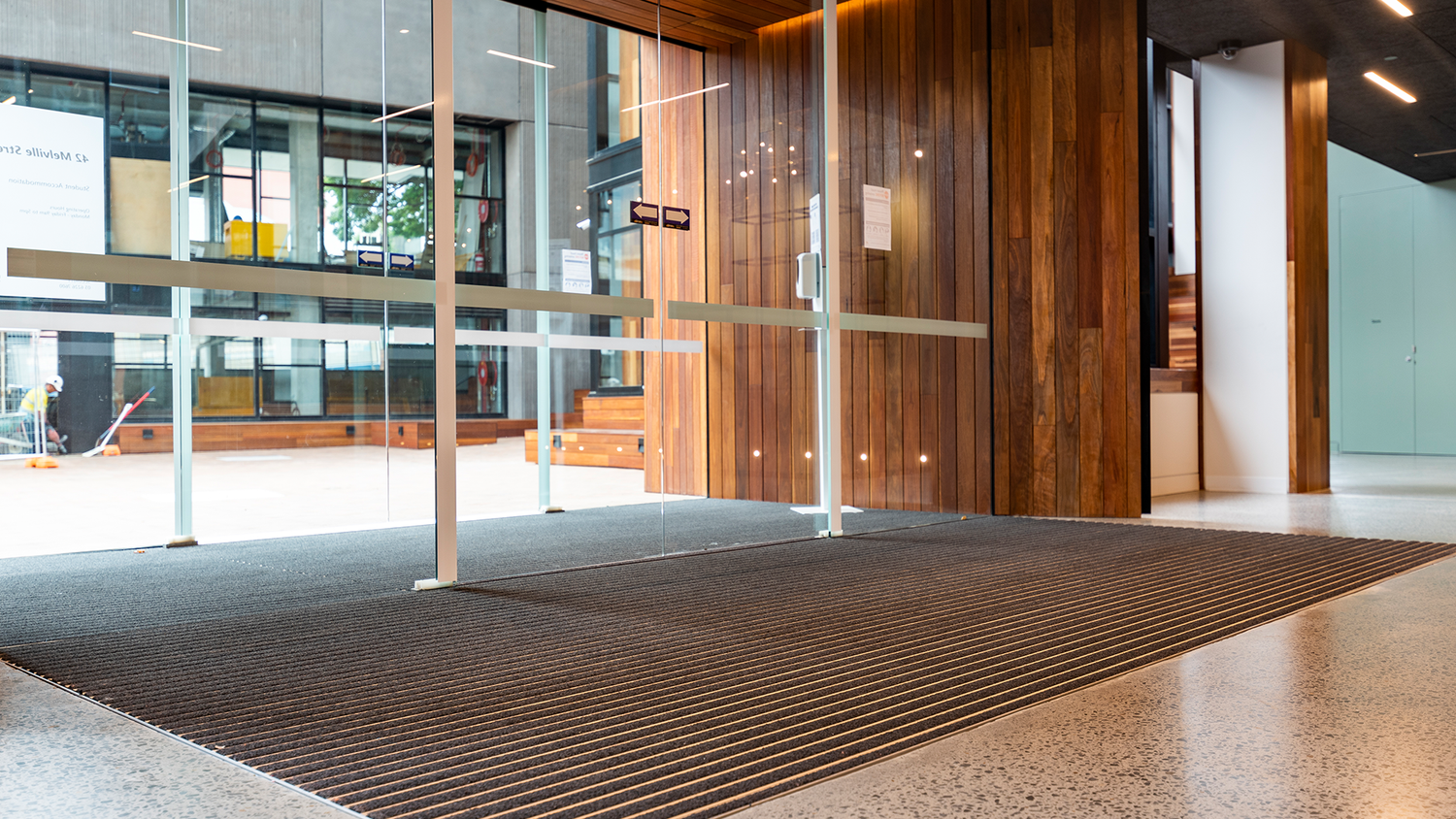 What is the recommended size for an entrance matting system?